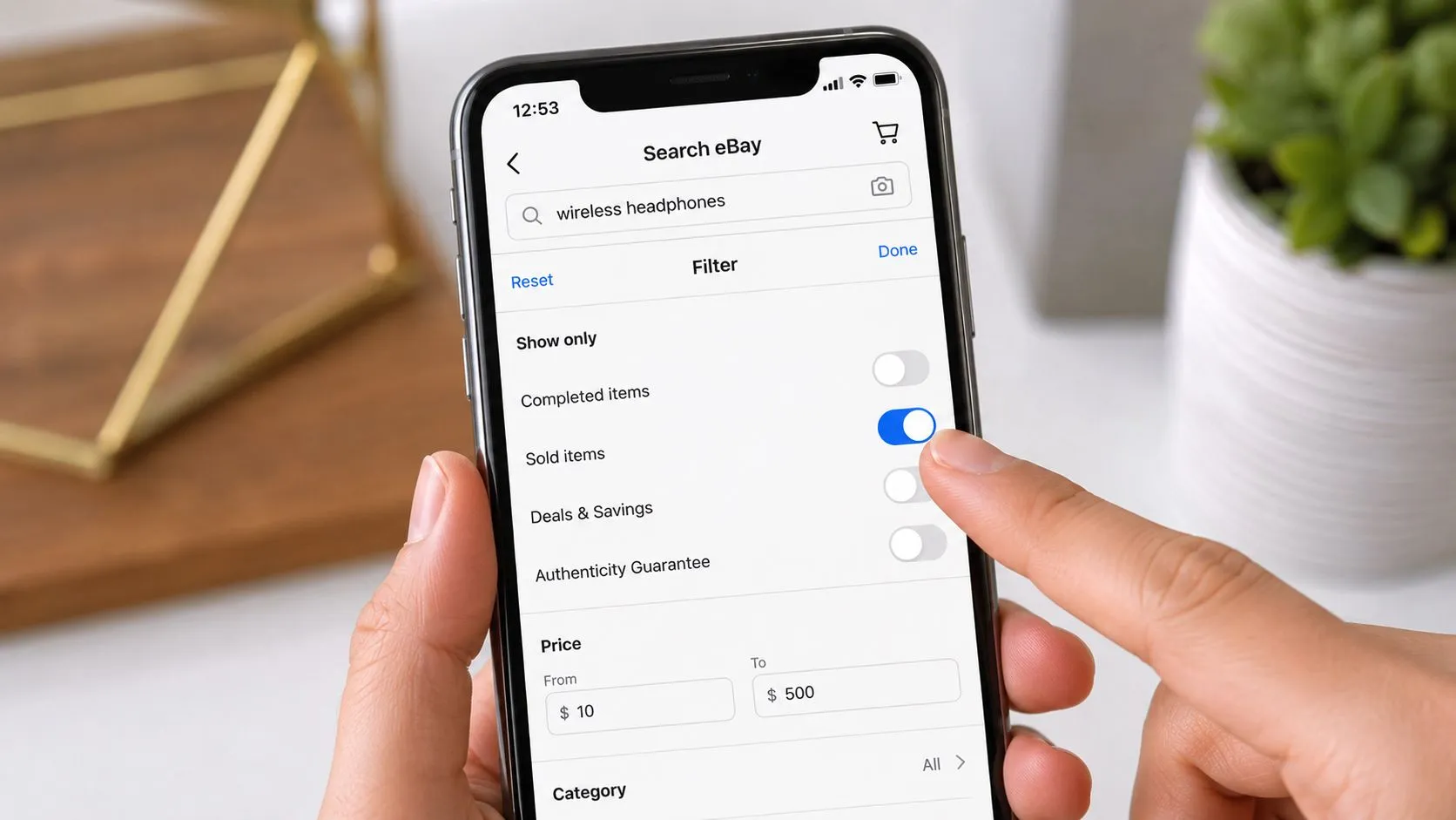 The eBay app's search filters on a phone, with the "Sold items" toggle switched on for a wireless headphones search