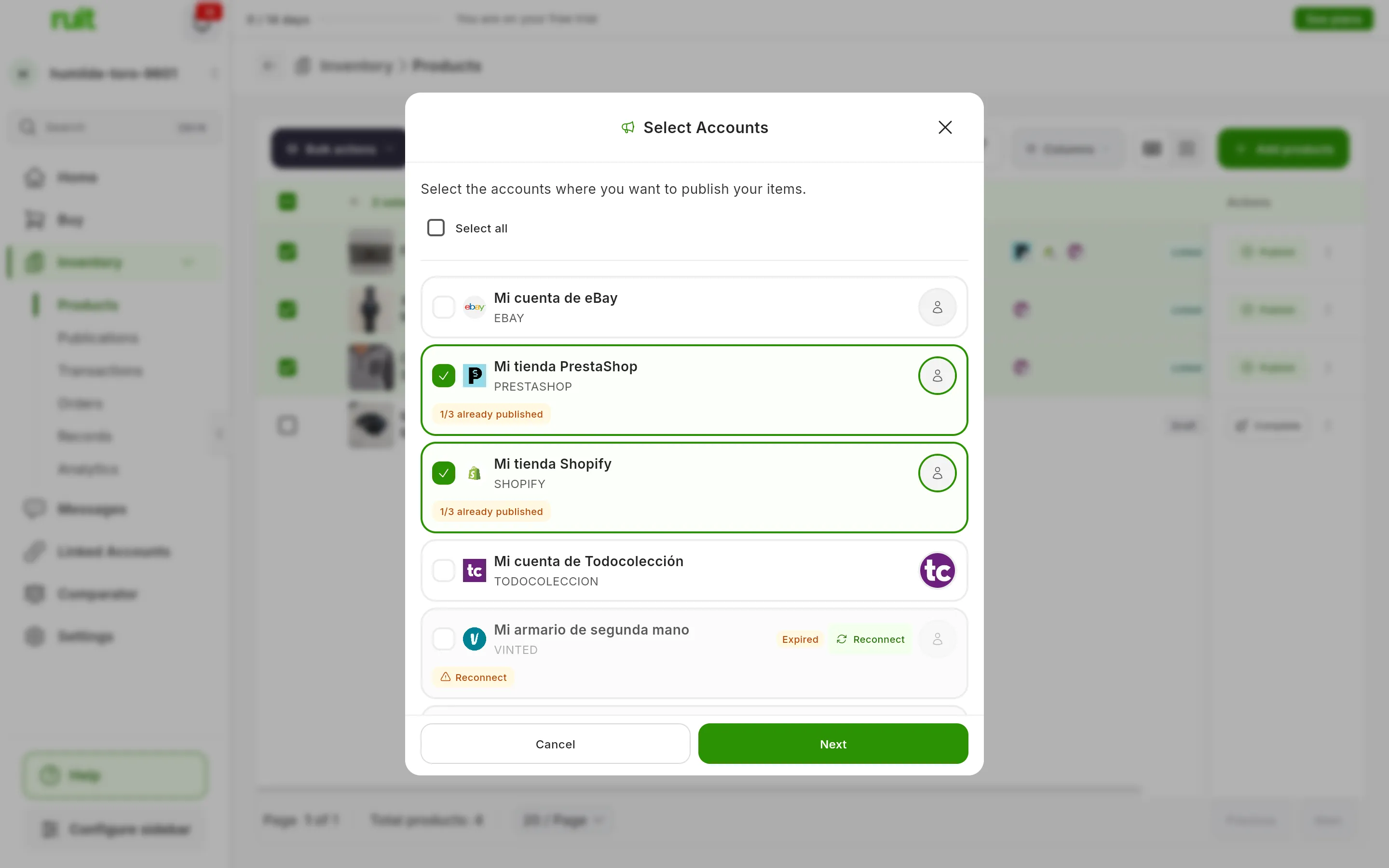 The Select Accounts step over the blurred table: Mi tienda PrestaShop and Mi tienda Shopify ticked, each with the 1/3 already published label; Mi cuenta de eBay and Mi cuenta de Todocolección unticked, and Mi armario de segunda mano expired, with Reconnect; at the bottom, Cancel and Next