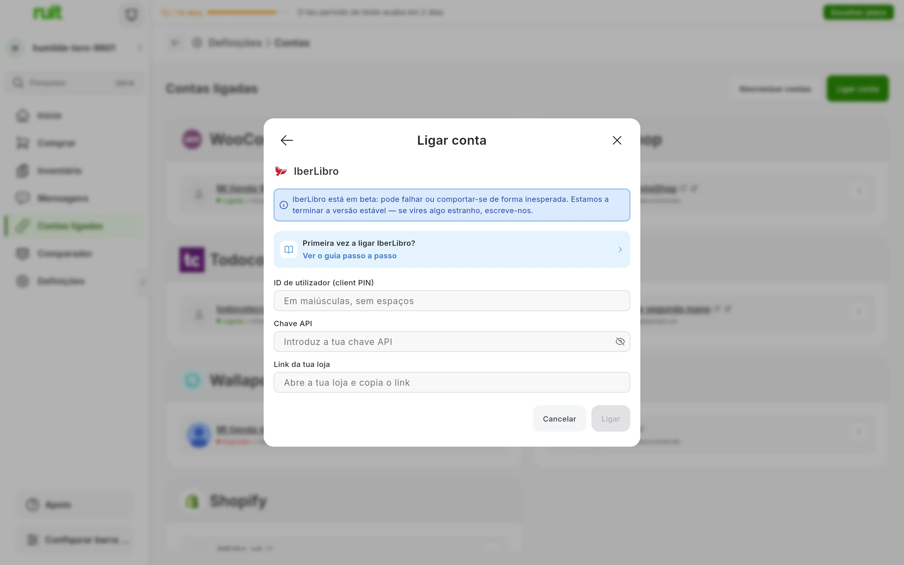 A janela de ligar o IberLibro no RUIT: o aviso de que o IberLibro está em beta, o atalho para este guia, os campos do ID de utilizador, da chave API e do link da loja, e os botões de cancelar e ligar